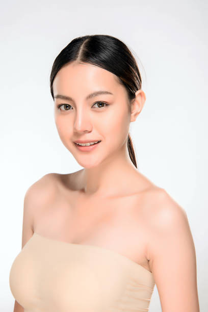 beautiful young asian woman with clean fresh skin - making human hair human face cosmetics imagens e fotografias de stock