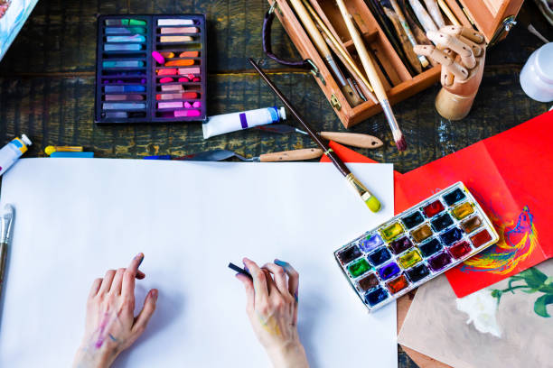 istock Young successful artist in art workshop studio 1128444918
