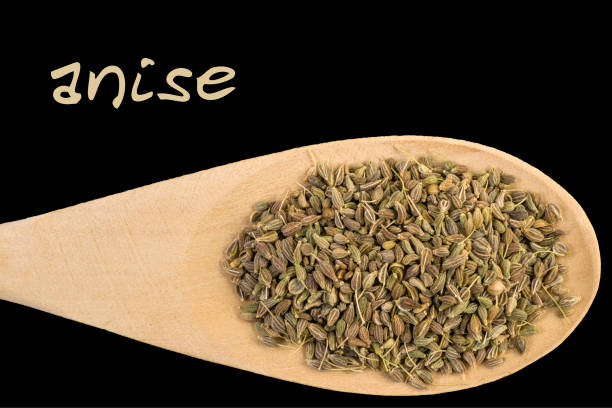 istock anise on wooden spoon isolated on black background 1128445350
