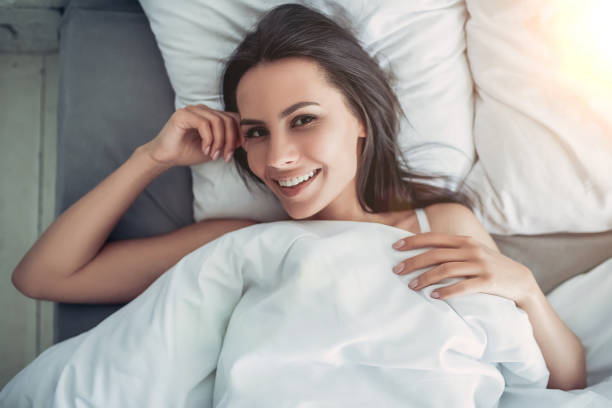 istock Charming young woman at home 1128446736