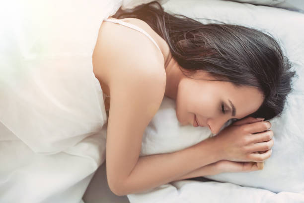 istock Charming young woman at home 1128446753