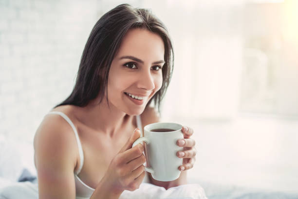 istock Charming young woman at home 1128446807