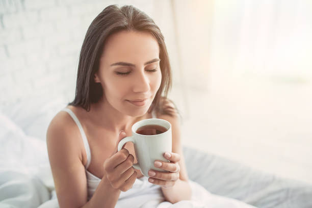 istock Charming young woman at home 1128446813