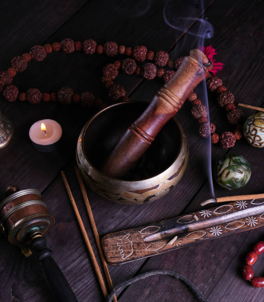istock copper singing bowl and a wooden stick 1128449423