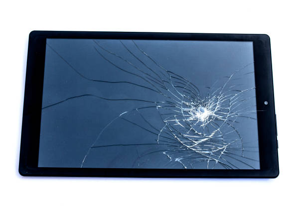 Shattered Broken tablet computer Tablet Screen On White Background stock photo