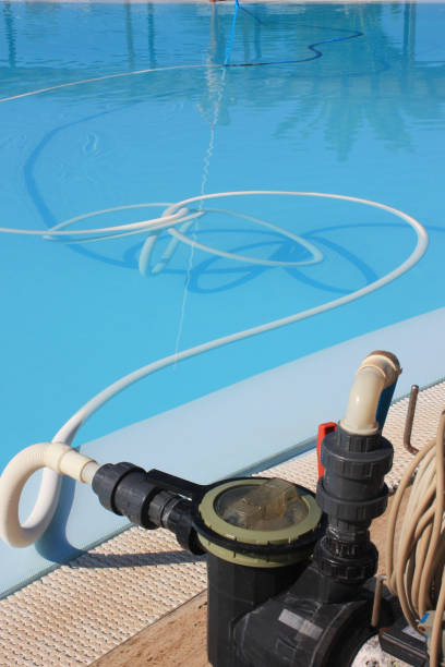 istock Swimming pool being cleaned  Holiday resort 1128451295