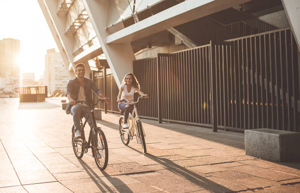 istock Romantic couple with bicycles in the city 1128451947