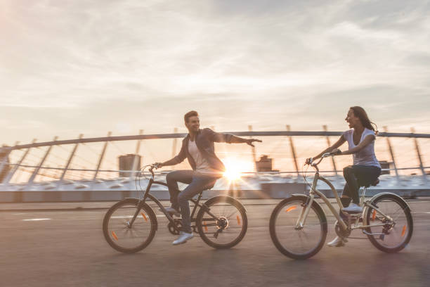 istock Romantic couple with bicycles in the city 1128452535