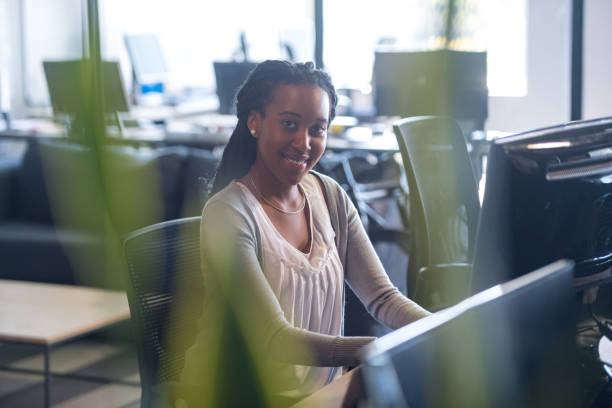 istock Successful businesswoman working at her desk 1128452711