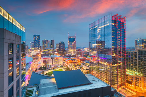 Nashville, Tennessee, USA downtown cityscape rooftop view at dusk.