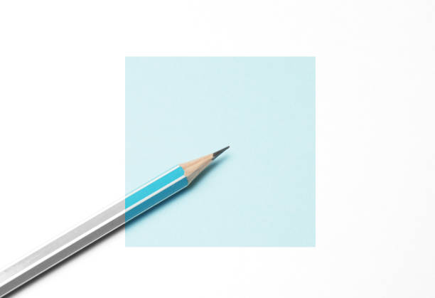 istock Blue pencil on a white background, minimalism. Abstract art, imagination, education 1128455059