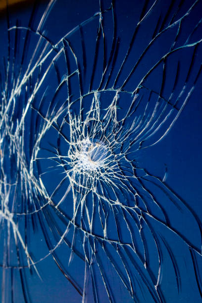 istock Shattered Tablet Glass Screen Close Up Abstract 1128455179