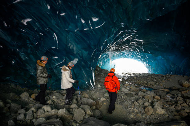 istock Guided tour in a majestic ice cave 1128455600