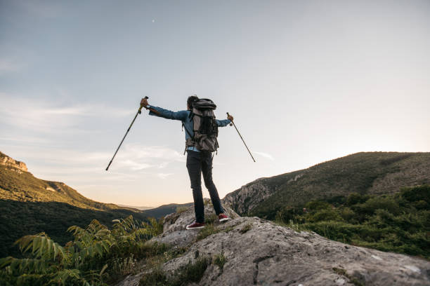 istock Hiker feeling free on mountain peak 1128456393