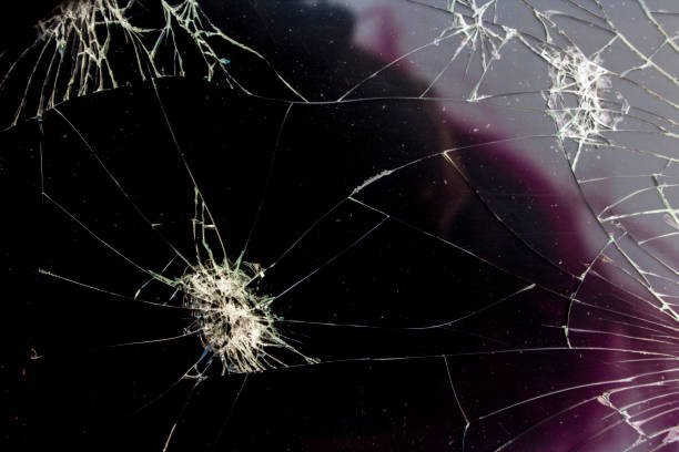 istock Shattered Tablet Glass Screen Close Up Abstract 1128458343