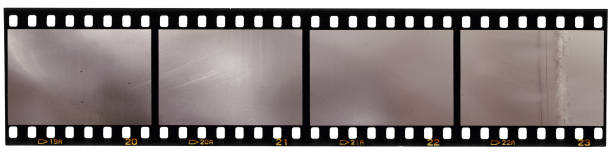 real scan of 35mm film strip or film material, just blend in your own work to make it look old and vintage real scan of 35 mm film on white film reel photos stock pictures, royalty-free photos & images
