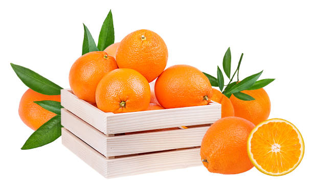 istock Oranges in a wooden box isolated on white background with clipping path 1128463975