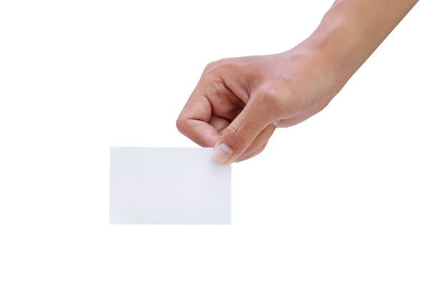 istock Male hand holding blank business card - clipping paths. 1128464288