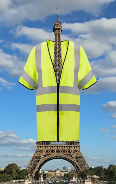 Photo of Big jacket symbol of Yellow vests movement on Eiffel Tower in Pa