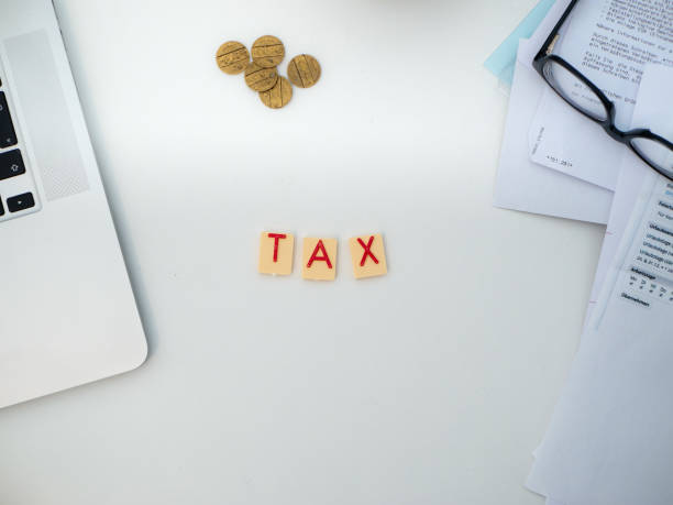 istock White desk with documents and different tools, letters saying 