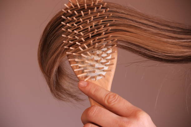 Young woman with comb brushing her blonde hair Beauty Product, Beauty Spa, Bleached Hair, Blond Hair, Grooming Product, Beauty Spa, Bleached Hair, Blond Hair, Hair, Hair Color brushing hair stock pictures, royalty-free photos & images