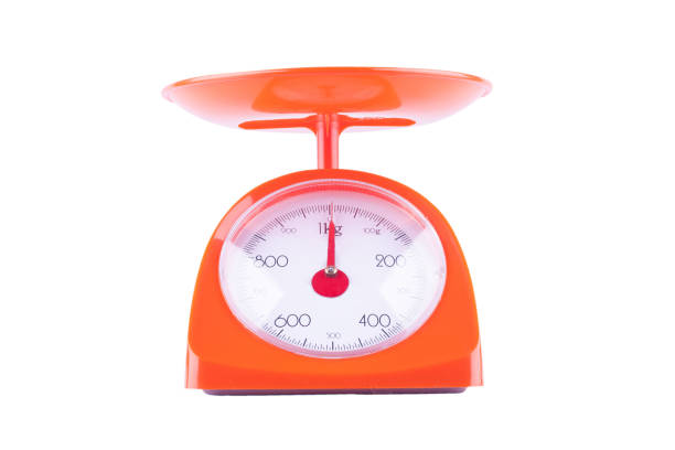 istock orange weighing scales with pan and dial on white background kitchen equipment object isolated 1128477554