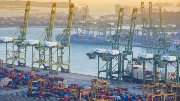 istock Logistics and transportation of Container Cargo ship and Cargo working crane bridge in shipyard 1128477730