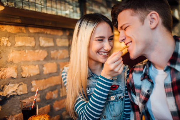 Couple sharing a meal stock photo