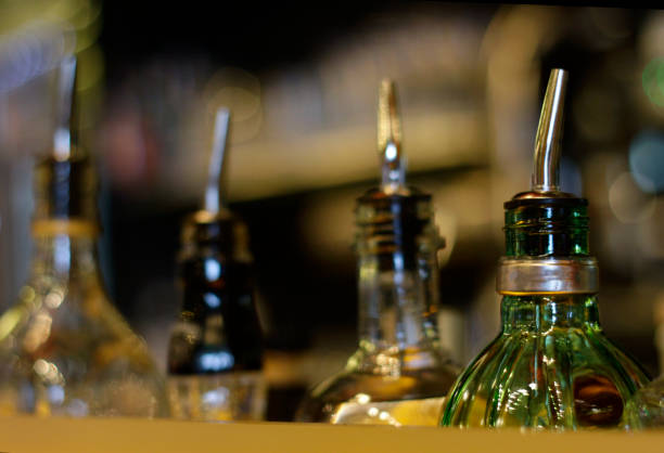 istock Bottles of gin and vodka lined up in a bar 1128479551
