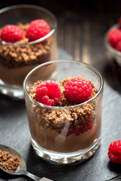 istock Chocolate dessert in glasses with raspberries 1128481033