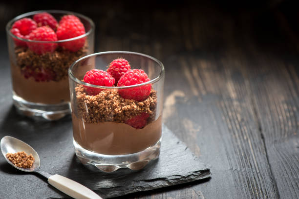 istock Chocolate dessert in glasses with raspberries 1128481035