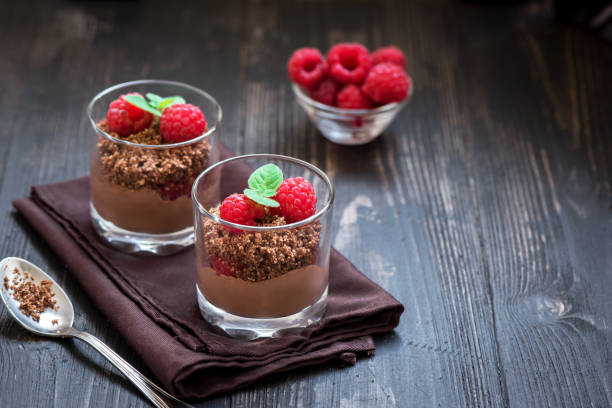 istock Chocolate dessert in glasses with raspberries 1128481037