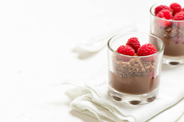 istock Chocolate dessert in glasses with raspberries 1128481048