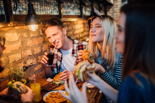 istock Friends having a drink together 1128482167