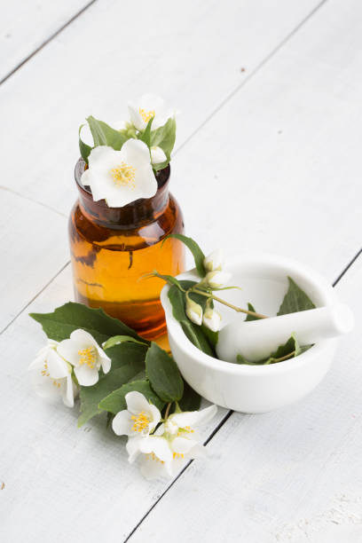 istock Spa concept - making essential oil with jasmine flowers 1128482289