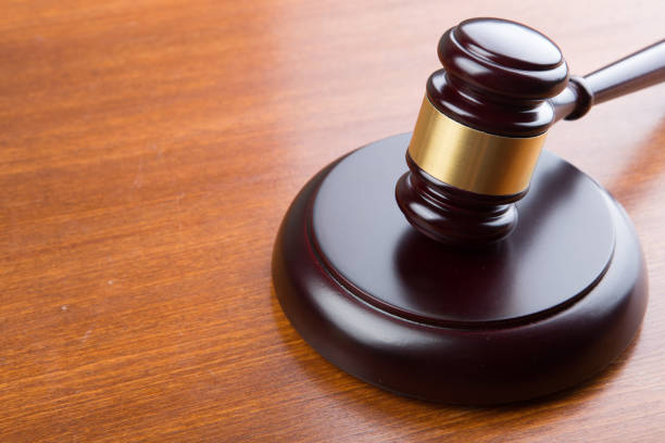 istock auction or justice concept - gavel on the wooden table 1128483612
