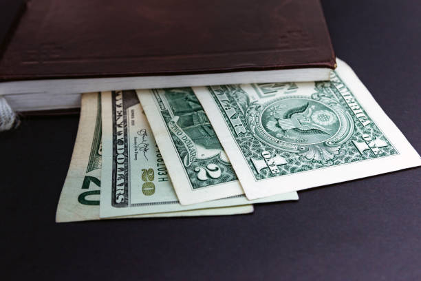 istock notebook, diary, book, financial report, American dollars. 1128485041