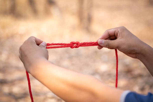istock Knot scout learning and teaching in camping scout in hills 1128485454