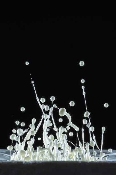 istock Water drops dancing color with sound in black background studio shot. 1128485594