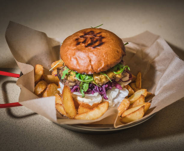 istock Burger and cheeseburger with french fries 1128490423