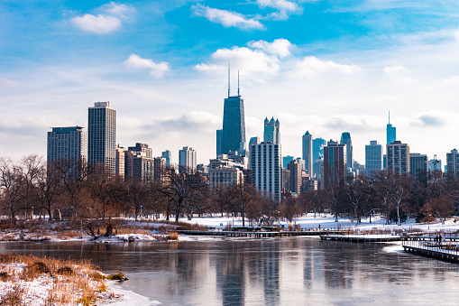 The Chicago skyline viewed from South Pond in Lincoln Park Chicago with snow and ice