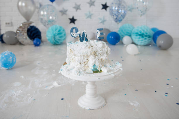 istock Smashed first birthday cake. Smash cake. One year. Blue colour. 1128492052