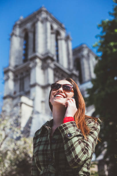 istock Girl in Paris talking on phone 1128494887