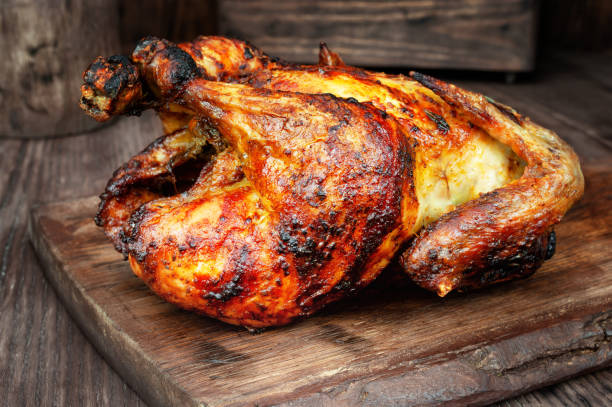 istock Roasted chicken on wooden table 1128495183