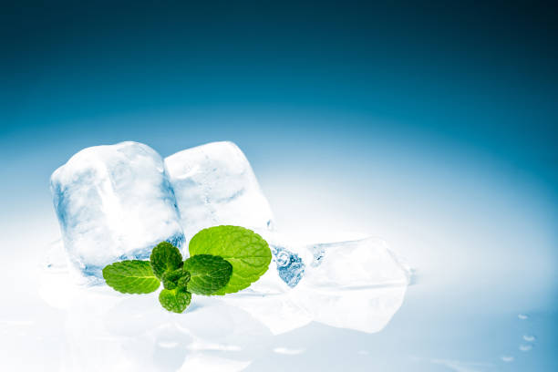 Hands removing ice due to sensitivity to cold on teeth