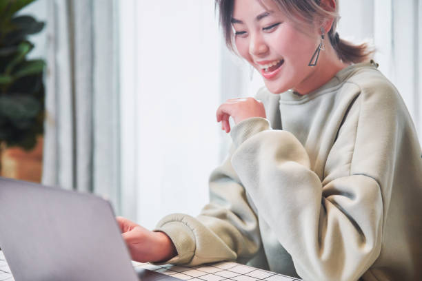 istock Woman sitting at a table 1128498930