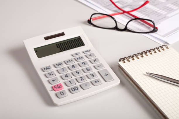 istock calculator and tax papers 1128501008
