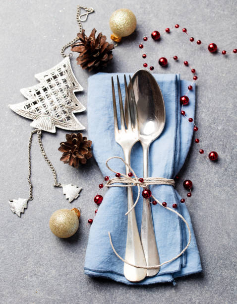istock Christmas and New Year holiday table place setting decorations. Grey background. Top view. 1128503400