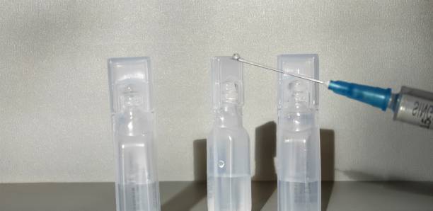 istock Medicine and syringe. Syringe with medicine. 1128503999
