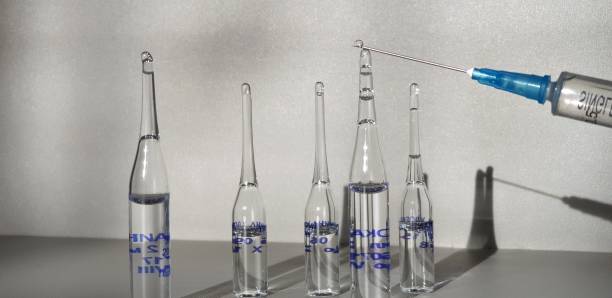 istock Medicine and syringe. Syringe with medicine. 1128504042